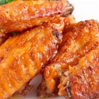 Hot Wings · 8 juicy deep-fried chicken wings tossed in our hot sauce. Comes with a bleu cheese sauce and...