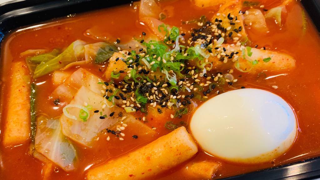Tteokbokki · Spicy Rice Cake (rice cake, cabbage, scallion, fish cake, soft boiled egg with house gochujang sauce)