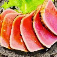 Tuna Tataki · Seared Tuna, mango, masago, seeds, scallion with house special ponzu sauce