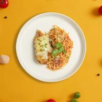 Golden Chicken Parm Pasta · Freshly baked chicken parmesan served with rossa (red) sauce linguine and drizzled with parm...