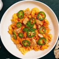 Caliente Chick Mac  · Spicy roasted chicken, chipotle cheese sauce, and jalapenos cooked in a blend of creamy cheese