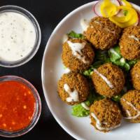 Falafel · Deep fried patty made from ground chickpeas served with tahini sauce, eight pieces.