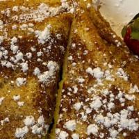 French Toast · 3 slices of cinnamon and vanilla French toast served with butter and syrup.