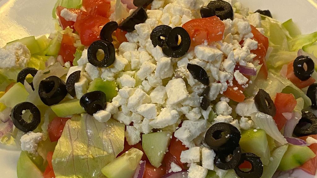 Greek Salad · Iceberg lettuce, feta cheese, tomato, cucumber, olives, red onion with Greek dressing.