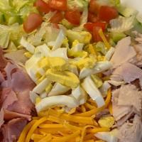 Chef Salad · Iceberg lettuce, cubed turkey, ham, Cheddar cheese, sliced hard boiled egg, cucumber and tom...