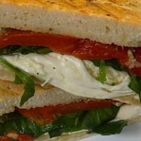 Italian Grilled Cheese Panini · Fresh mozzarella cheese, spinach, roasted peppers, pesto spread on rosemary bread.