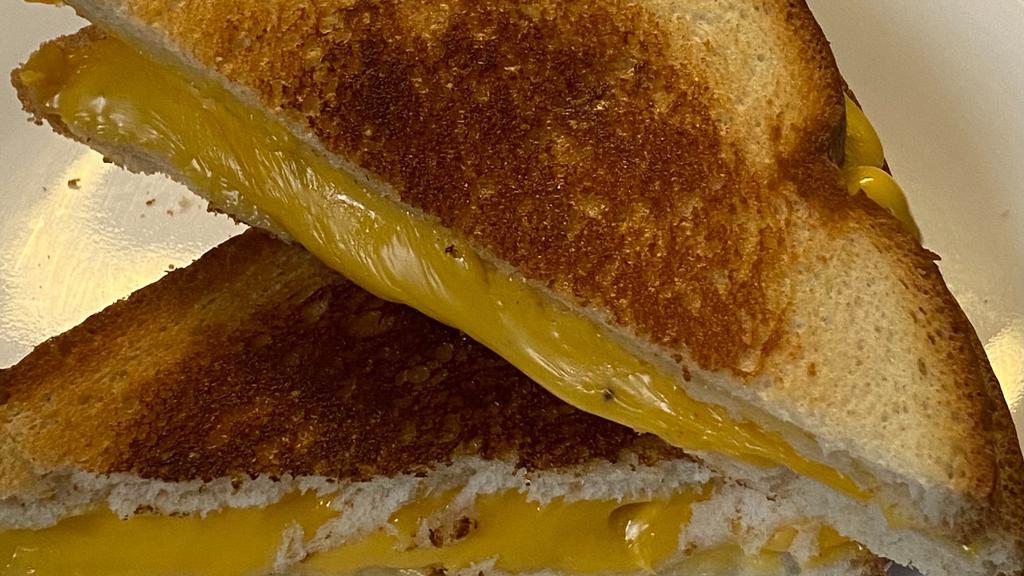 Grilled Cheese Classic Sandwiches · Melted American cheese grilled on white bread.