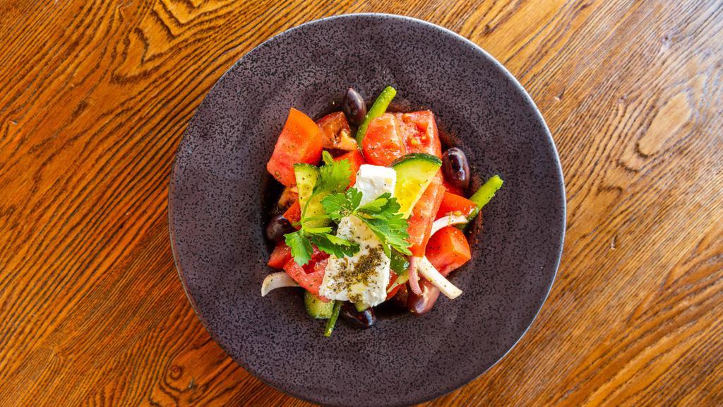 The Mediterranean Salad · Organic tomato, kumato tomato, onion, green pepper, cucumbers, black olives, feta cheese, olive oil, red vinegar.