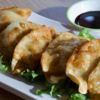 Ap 3. Chicken Pot Stickers (3) · Lightly pan-fried dumplings filled with chichen. 치킨 만두.