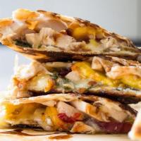 Chicken Quesadilla · With guacamole salsa and sour cream. served with drinks.