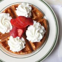 Crisp Golden Brown Belgian Waffle · Served with butter & syrup
