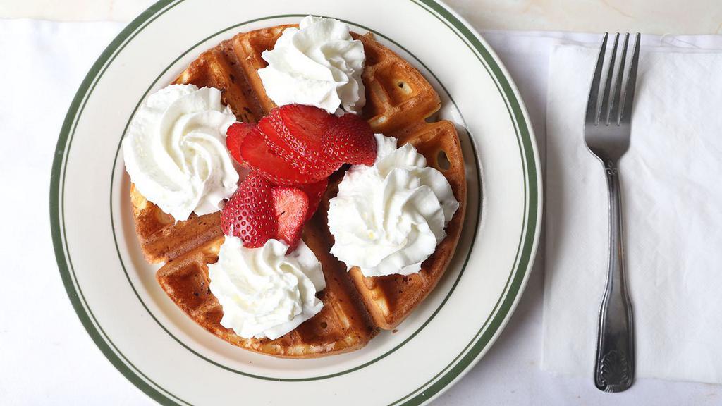 Crisp Golden Brown Belgian Waffle · Served with butter & syrup