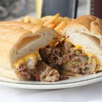 Philly Cheesesteak Sandwich · Served with onion, peppers and mushrooms. Served with french fries, coleslaw and pickle.