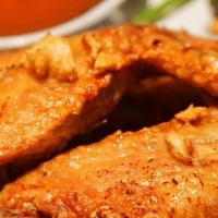 Peek Gai Tod (Chicken Wings) · Fried marinated chicken wings with sweet chili sauce.