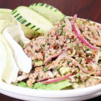 Larb (Spicy Ground Meat Salad) · Spicy. Ground meat, red onion, mint, scallion, cilantro, chili powder, and lime dressing.