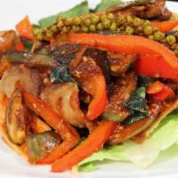 Pad Ped · Thai eggplant, bell pepper, basil, wild ginger with spicy curry paste sauce.