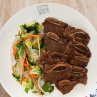 Beef Short Ribs · Classic Korean BBQ beef short ribs marinated in our house sauce with stir-fried vegetables o...