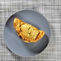 Beef & Cheese Empanada · Seasoned ground beef with cheddar cheese.
