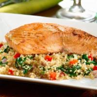 Balsamic Salmon · Grilled salmon drizzled with balsamic glaze and served on a bed of quinoa with spinach, pepp...