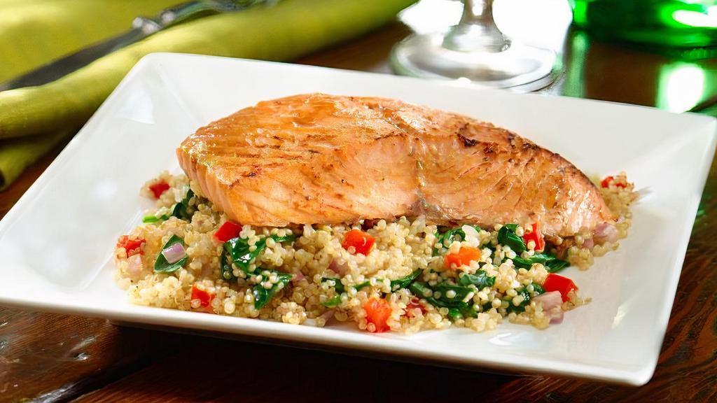 Balsamic Salmon · Grilled salmon drizzled with balsamic glaze and served on a bed of quinoa with spinach, peppers and red onions.  Plus, your choice of soup or salad.