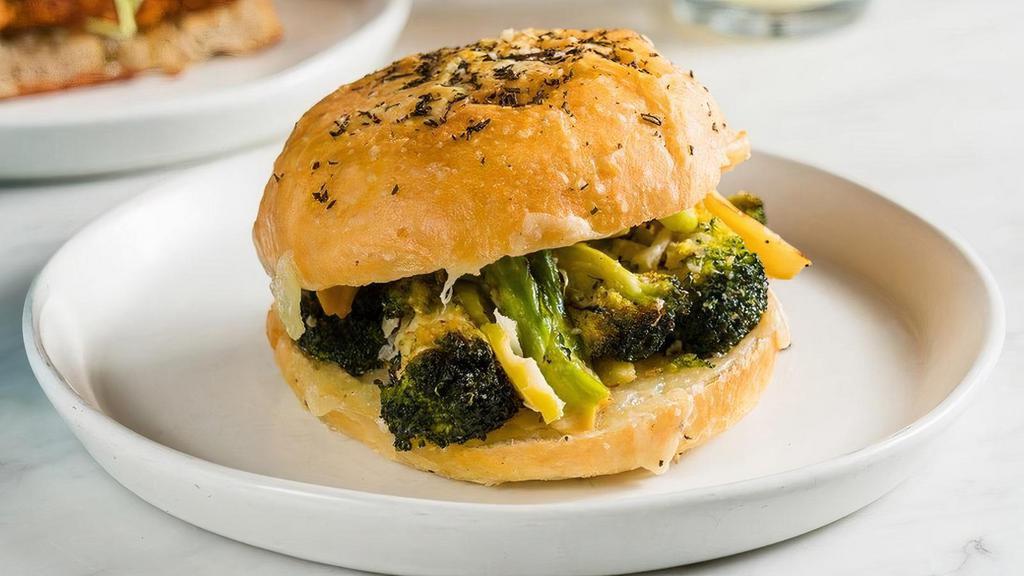 Broccoli Melt · Roasted broccoli with melted Manchego, chili flakes, and garlic.