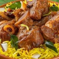 Goat Biryani · goat cooked with rice and spice.