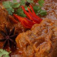 Goat Curry · Goat cooked with curry and spices.