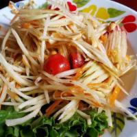 Green Papaya Salad · Thai staple salad in every meal, fresh green papaya, long beans, tomato, Thai chili, lime ju...