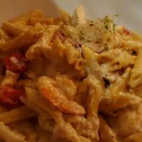 Penne Alfredo · Cream reduction, shrimp, grilled chicken grape tomatoes.