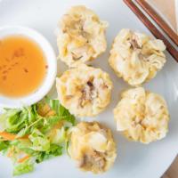 Thai Dumpling · Steamed pork and shrimp mixed with water chestnuts and wrapped in wonton skin. Served with g...