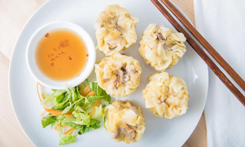 Thai Dumpling · Steamed pork and shrimp mixed with water chestnuts and wrapped in wonton skin. Served with ginger soy sauce dipping.