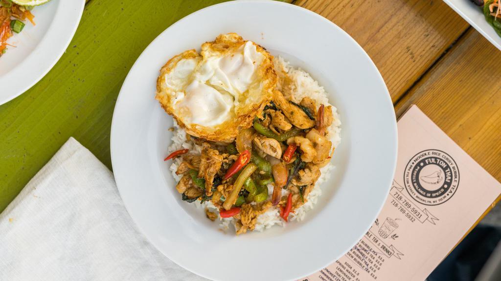 Kar Paw And Eggs · Stir-fried chicken and shrimps, bell peppers, and basil topped with 2 fried eggs. Served over rice. (Spicy).
