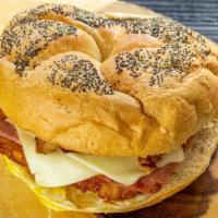 The King · Ham, bacon, egg, cheese and hash brown on a roll.