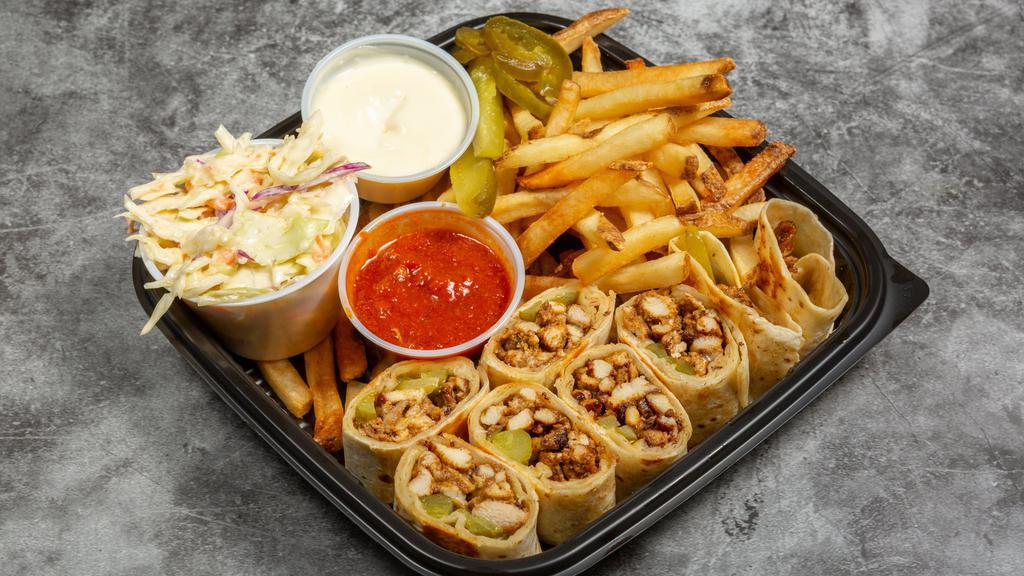 Shawarma Arabi · Syrian style chicken Shawarma wrapped with garlic whip and pickles, then pressed toasted and cut to small bites. Comes with fries, coleslaw and garlic sauce.