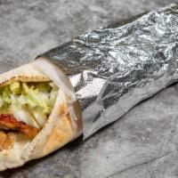 The Cute Lebanese Shawarma · Chicken Shawarma in a lebanese flat pita wrap with lettuce, pickles and garlic whip.
