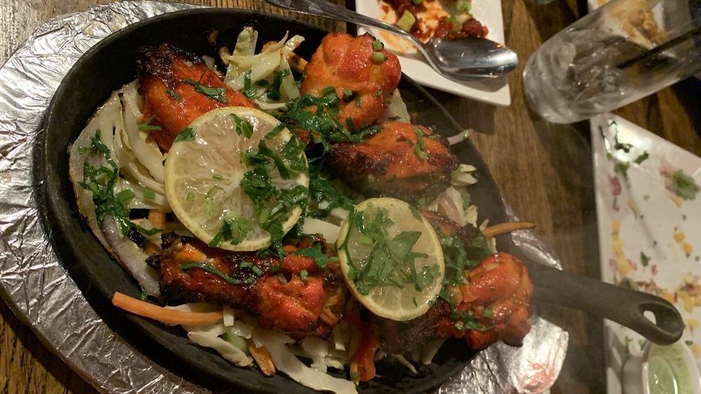  Kalmi Kabab · Marinated chicken wings in yogurt and spices grilled in clay oven.