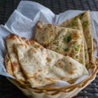  Naan · Soft bread made of white flour baked in a clay oven.