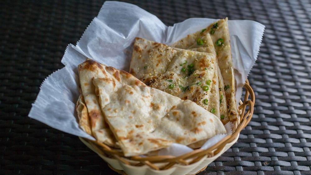  Naan · Soft bread made of white flour baked in a clay oven.