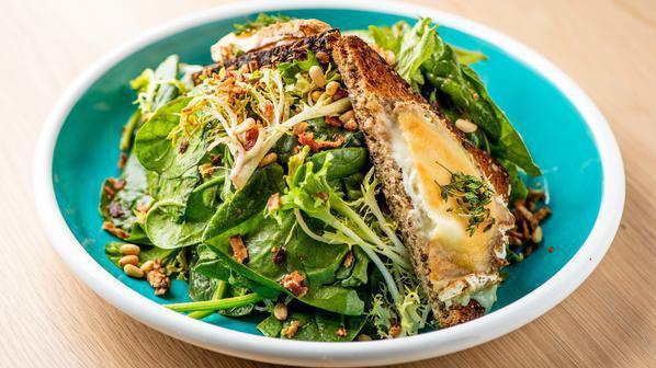 Goat Cheese Salad · Frisée, spinach, bacon crumble, pine nuts and toasts.