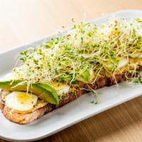 Hummus & Avocado Tartine · Hard-boiled egg and sprouts on sourdough.