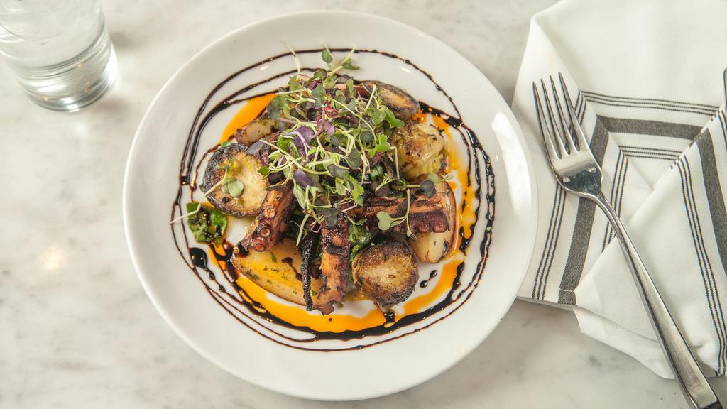 Grilled Octopus · Fingerling potatoes, wilted spinach, brussels sprouts, truffle balsamic vinaigrette.
