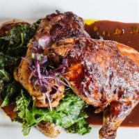 Roasted Chicken · Braised kale, fingerling potatoes, turnips, & spinach.
