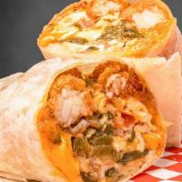 Combo Burrito · Flour tortilla filled with scrambled eggs, tater tots, bacon, sausage, grilled onions, grill...