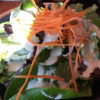 Green Salad · Lettuce, cucumber, plum tomatoes, mint leaves, julienne carrots, topped with fried red onion...