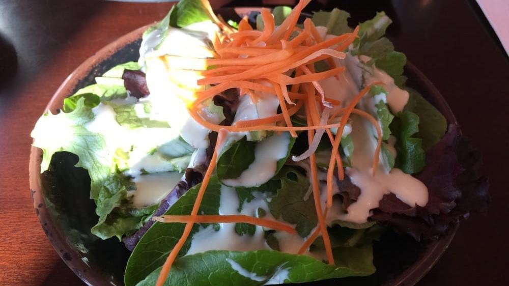Green Salad · Lettuce, cucumber, plum tomatoes, mint leaves, julienne carrots, topped with fried red onion and roasted peanuts. Served with Vietnamese vinaigrette sauce on the side.