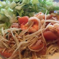 Green Shredded Papaya With Shrimp · Shredded green papaya, mint leaves, topped with roasted peanuts. Served with Vietnamese vina...