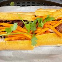 Pork Chop Sandwich · Pork chop with mayo, butter, cucumber, julienne carrots and daikon radish, and cilantro, ser...