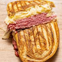 Classic Reuben Panini · corned beef or turkey, kraut, Swiss, Russian dressing cheddar cheese, leaf lettuce, tomato a...
