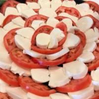 Caprese Salad · Tommy's homemade fresh mozzarella with sliced heirloom tomatoes, with balsamic glaze, Extra ...
