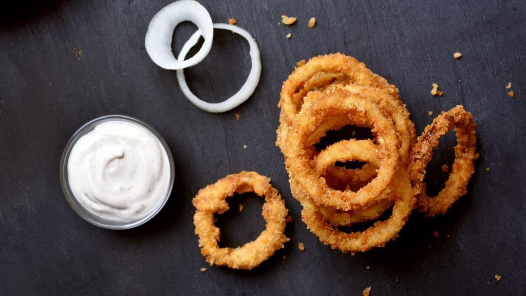 Onion Rings · Thick cut, battered onion rings fried to golden perfection.